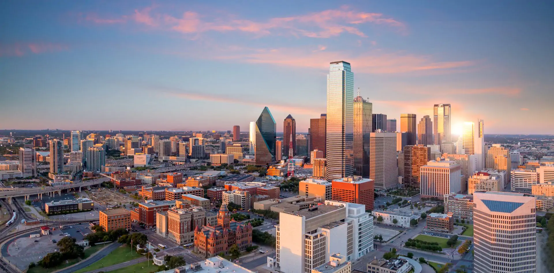 Dallas,,Texas,Cityscape,With,Blue,Sky,At,Sunset,,Texas